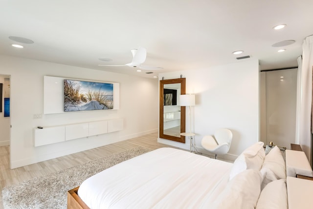 bedroom featuring recessed lighting, visible vents, a ceiling fan, wood finished floors, and baseboards