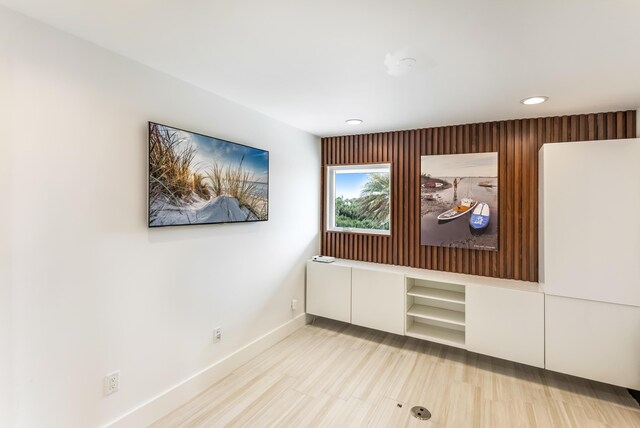 spare room with baseboards and recessed lighting