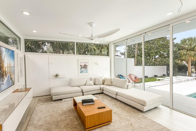 sunroom featuring ceiling fan