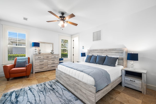 bedroom featuring ceiling fan and light tile flooring