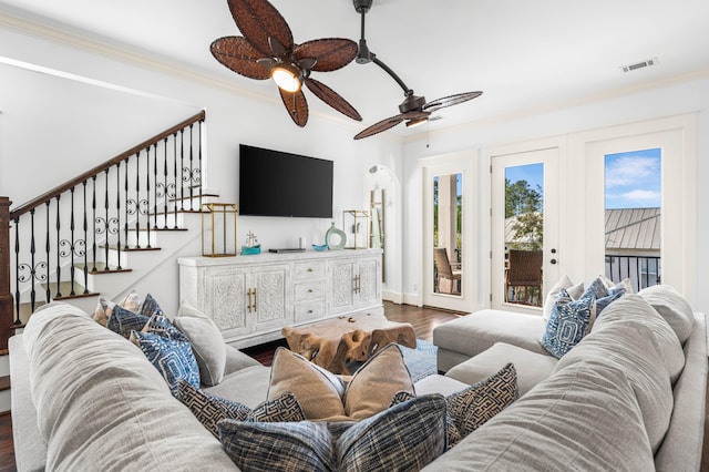 living room with ornamental molding, dark hardwood / wood-style flooring, and ceiling fan