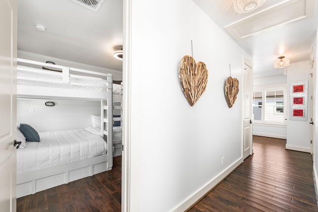 bedroom with dark hardwood / wood-style floors