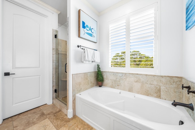 bathroom featuring tile flooring, crown molding, and plus walk in shower