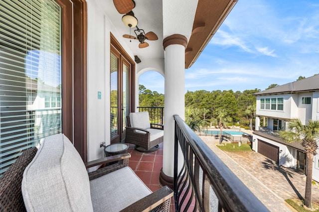 balcony with a fenced in pool