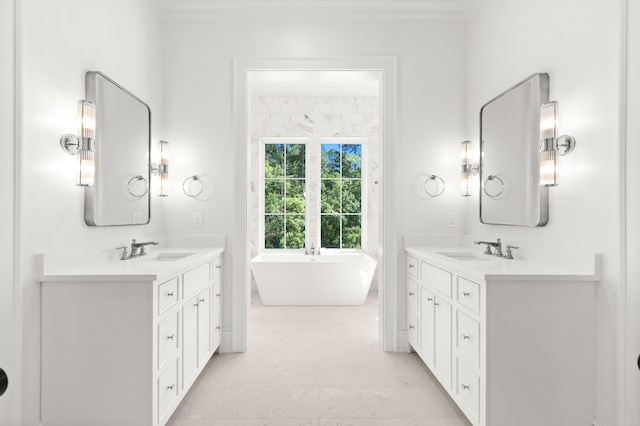 bathroom with dual bowl vanity, tile floors, and a bath