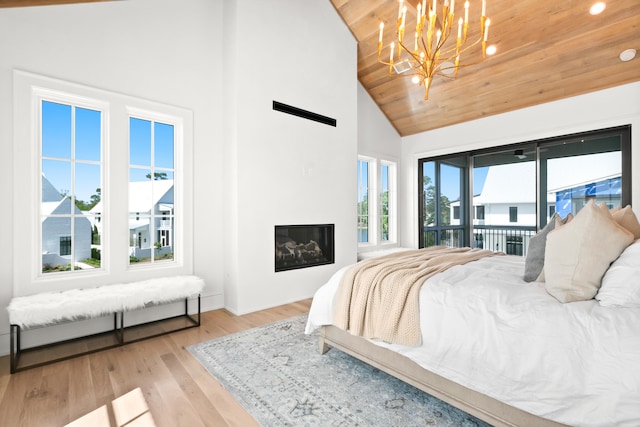 bedroom featuring access to outside, high vaulted ceiling, light hardwood / wood-style flooring, wooden ceiling, and a notable chandelier