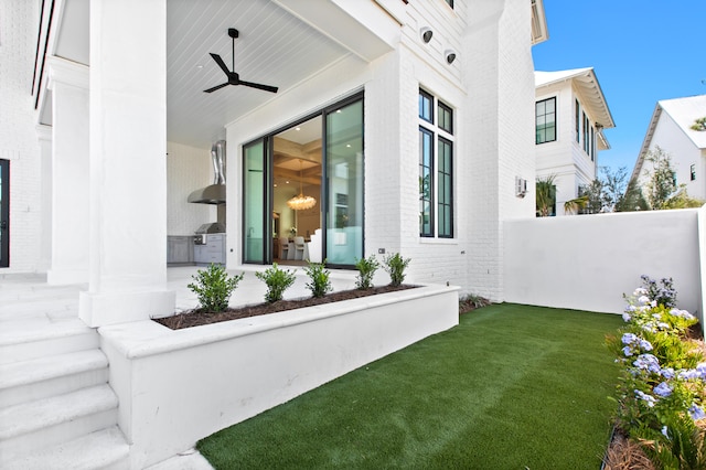 exterior space featuring ceiling fan