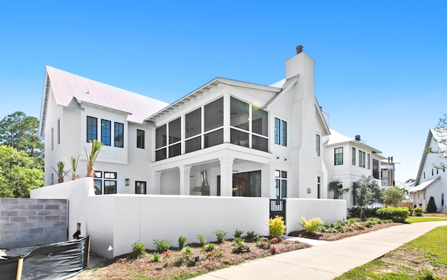 view of front of house featuring a sunroom