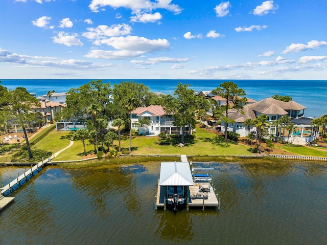 birds eye view of property with a water view