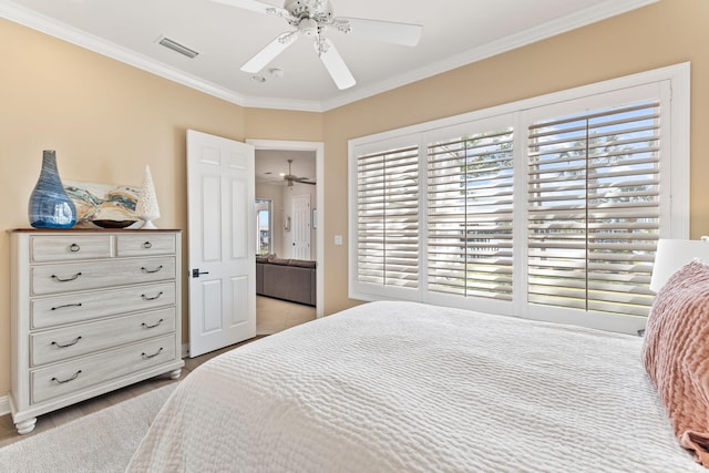 bedroom with ceiling fan, light hardwood / wood-style floors, and ornamental molding