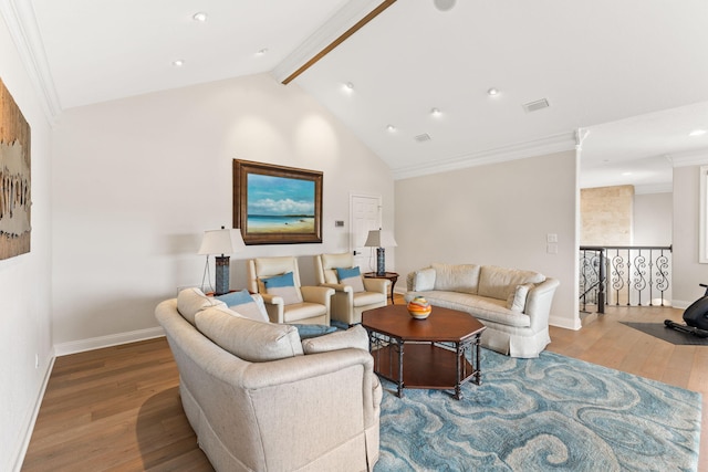 living room with hardwood / wood-style flooring and lofted ceiling with beams