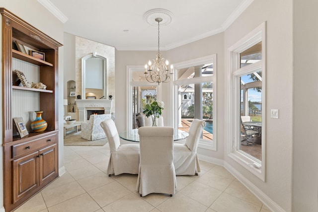 dining space with plenty of natural light, a notable chandelier, and light tile flooring