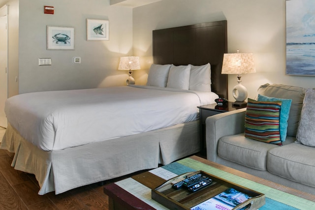 bedroom with dark hardwood / wood-style flooring