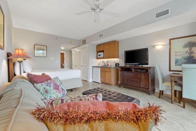 living room featuring ceiling fan and light tile floors