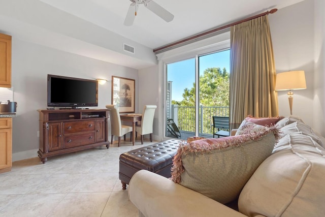 living room with plenty of natural light, ceiling fan, and light tile floors