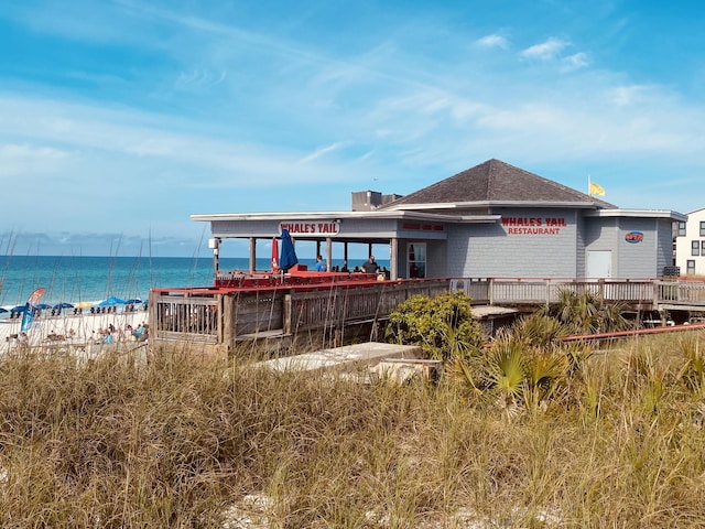 back of house with a water view