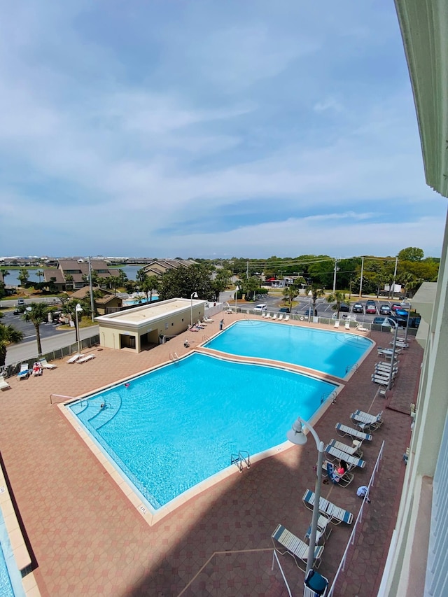 view of swimming pool with a patio area