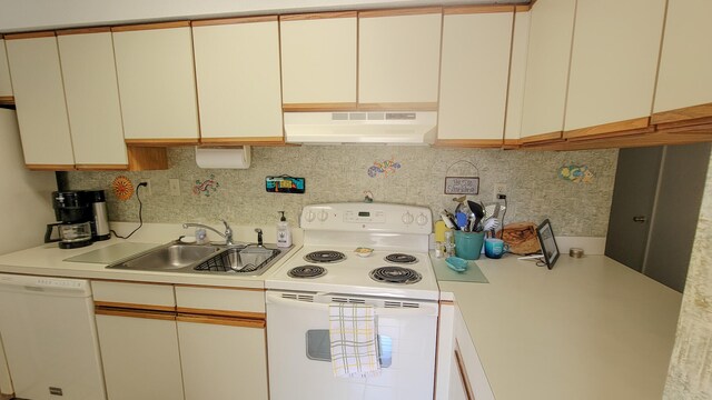 kitchen with backsplash, range hood, white appliances, and sink