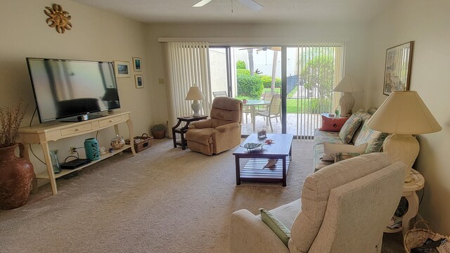 carpeted living room featuring ceiling fan