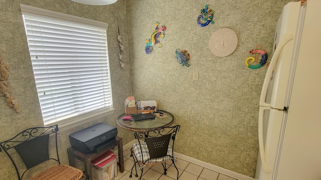 dining space featuring tile floors