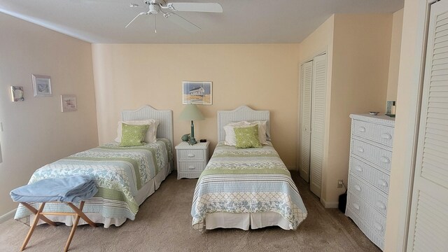 bedroom featuring ceiling fan and carpet