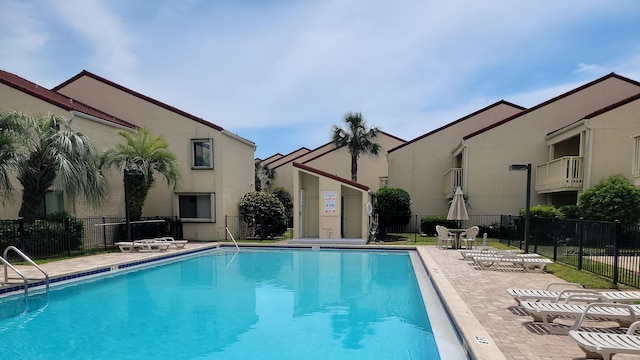 view of swimming pool with a patio area