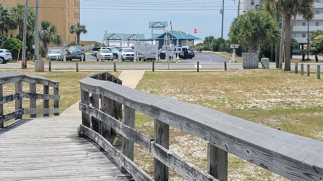 view of dock with a yard