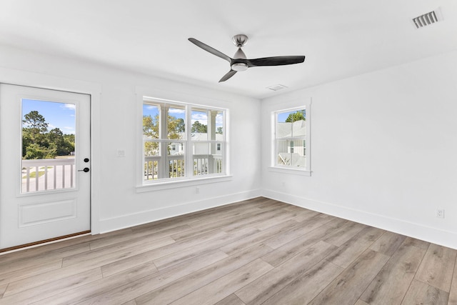 interior space with ceiling fan and light hardwood / wood-style flooring