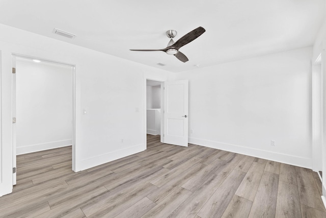 spare room featuring ceiling fan and light hardwood / wood-style floors