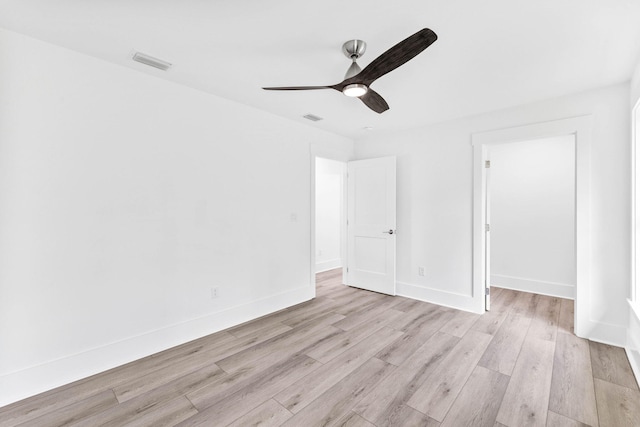 spare room with ceiling fan and light hardwood / wood-style flooring