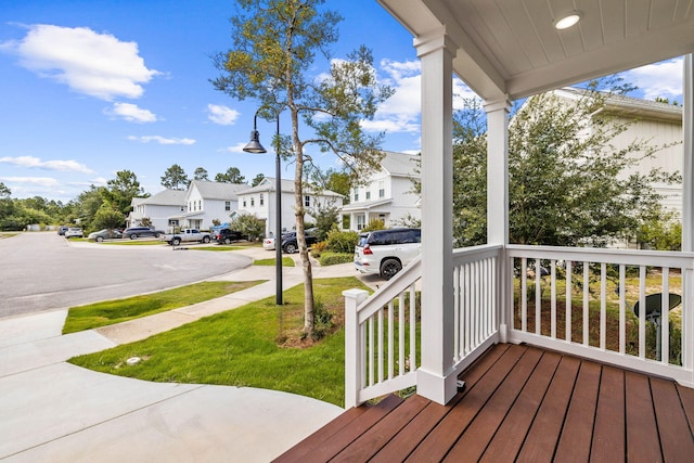 wooden terrace featuring a porch