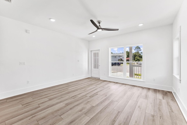 empty room featuring ceiling fan and light wood-type flooring