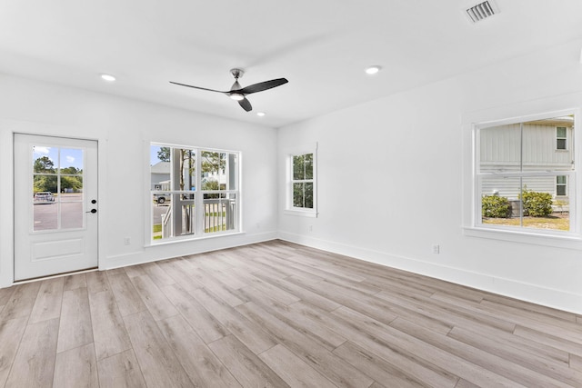 unfurnished room featuring ceiling fan and light hardwood / wood-style flooring