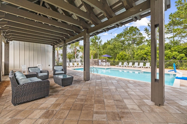 view of pool with outdoor lounge area and a patio