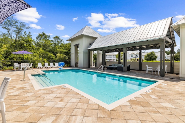 view of pool featuring a gazebo, an outdoor hangout area, and a patio