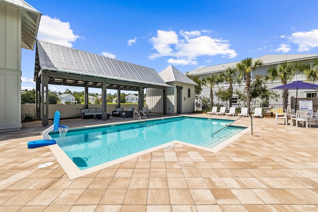 view of pool featuring a gazebo and a patio