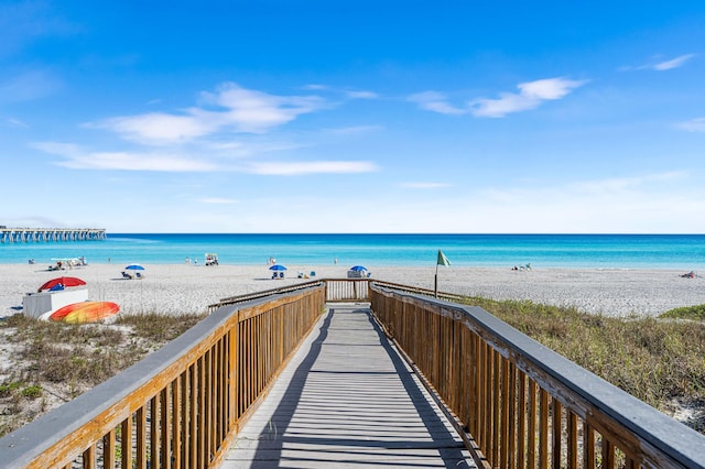 view of home's community featuring a view of the beach and a water view