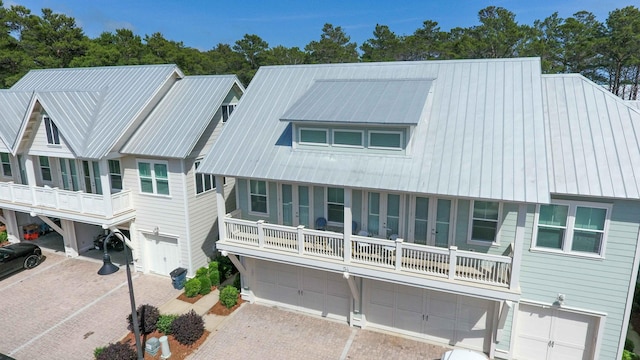 view of front of property with a balcony and a garage