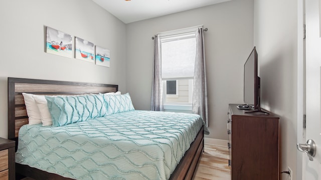 bedroom with light hardwood / wood-style floors