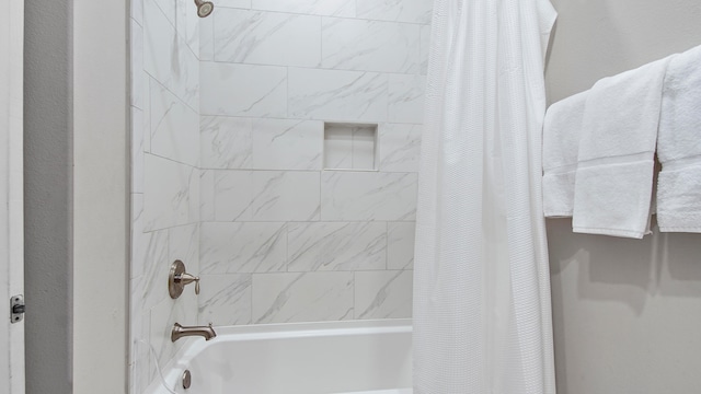 bathroom with shower / bathtub combination with curtain