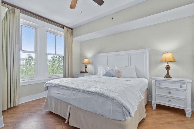 bedroom featuring wood-type flooring and ceiling fan