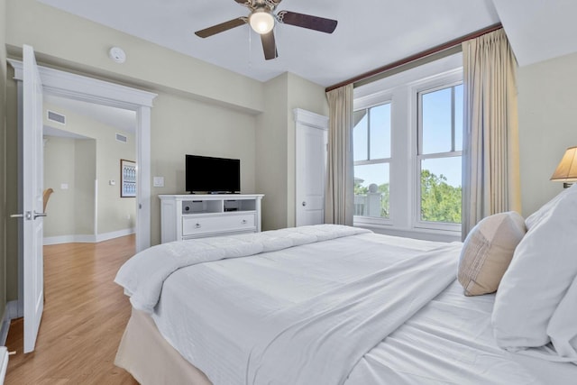 bedroom featuring light hardwood / wood-style floors and ceiling fan