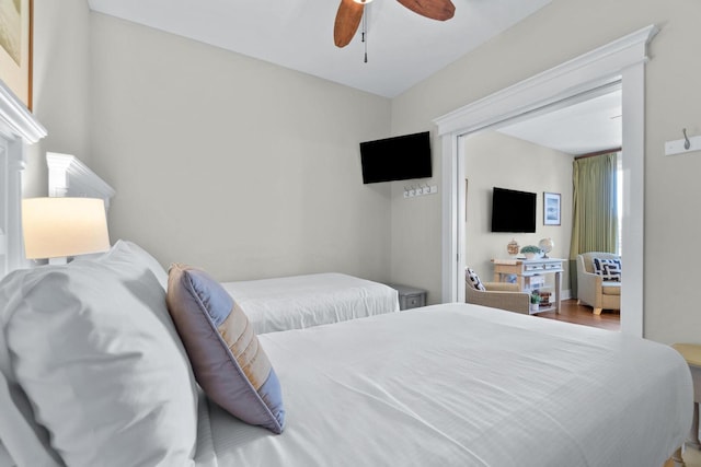 bedroom with wood-type flooring and ceiling fan