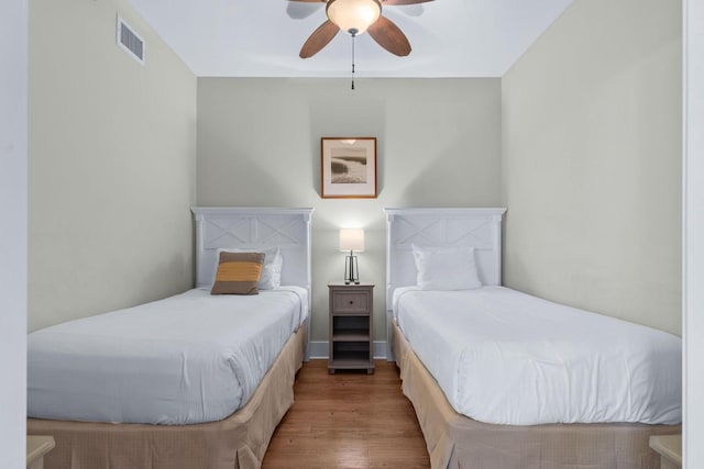 bedroom featuring wood-type flooring and ceiling fan