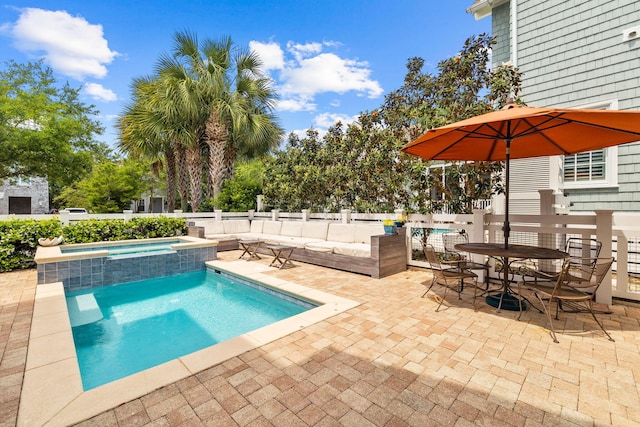 view of swimming pool with a patio area and an in ground hot tub