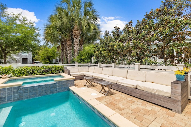 view of swimming pool with an in ground hot tub and a patio