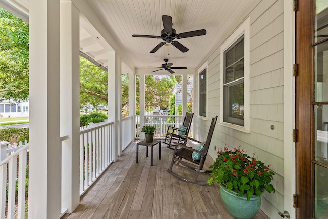 wooden deck featuring ceiling fan