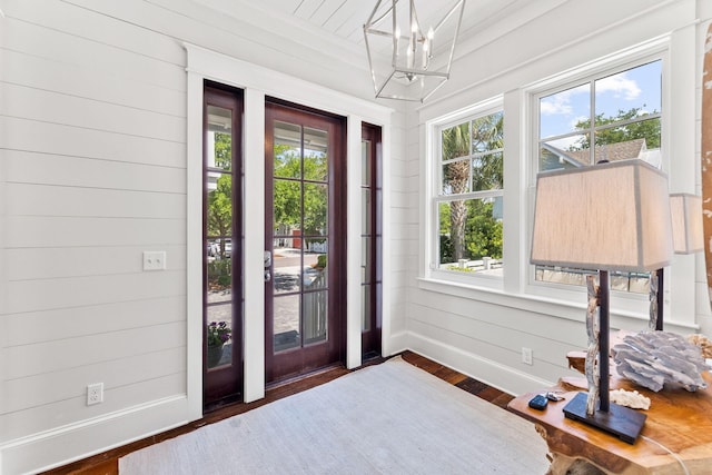 foyer featuring a chandelier and dark hardwood / wood-style floors