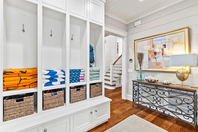 mudroom featuring dark hardwood / wood-style flooring and crown molding