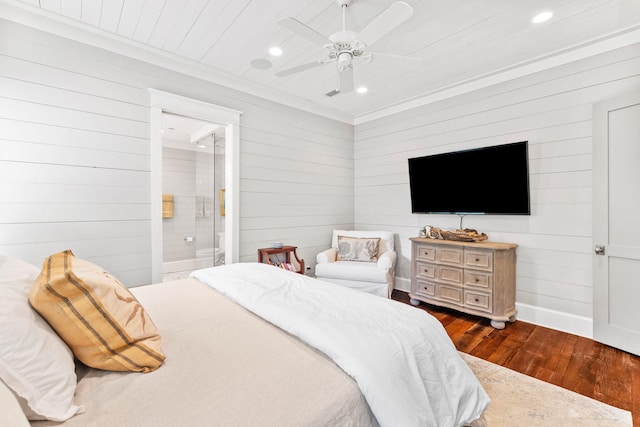 bedroom featuring crown molding, dark wood-type flooring, ceiling fan, and ensuite bathroom